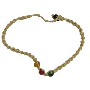 Woven green, red, yellow eye necklace